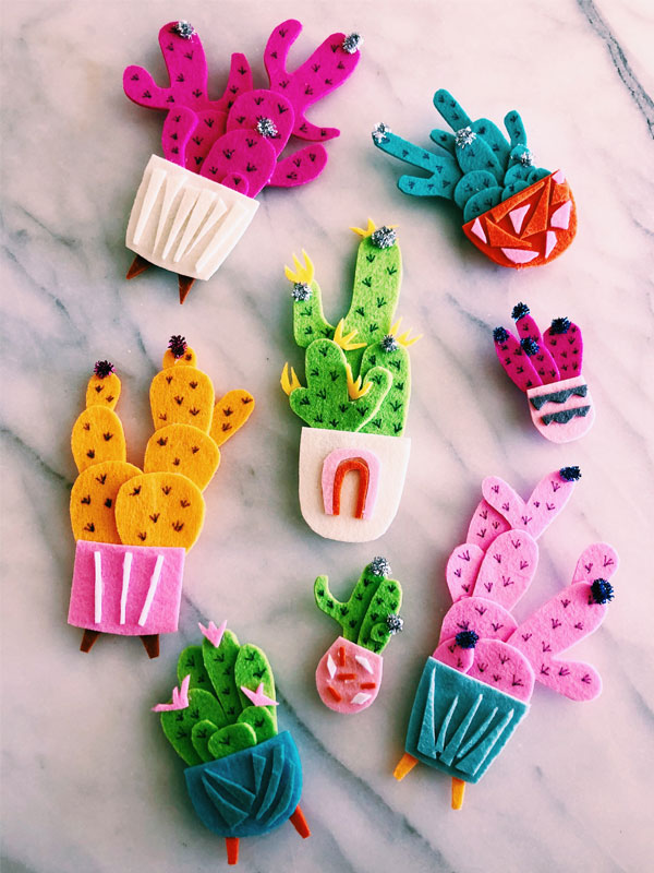 DIY cactus planter magnets - you can make these colorful magnets out of scrap felt. They're like little mid century pieces of candy for your refrigerator. 